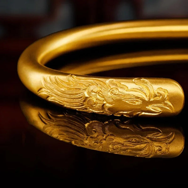 Exquisite 24K Gold Fengming Longyue Bracelet: Engraved with Ancient Symbols for Prosperity & Harmony.